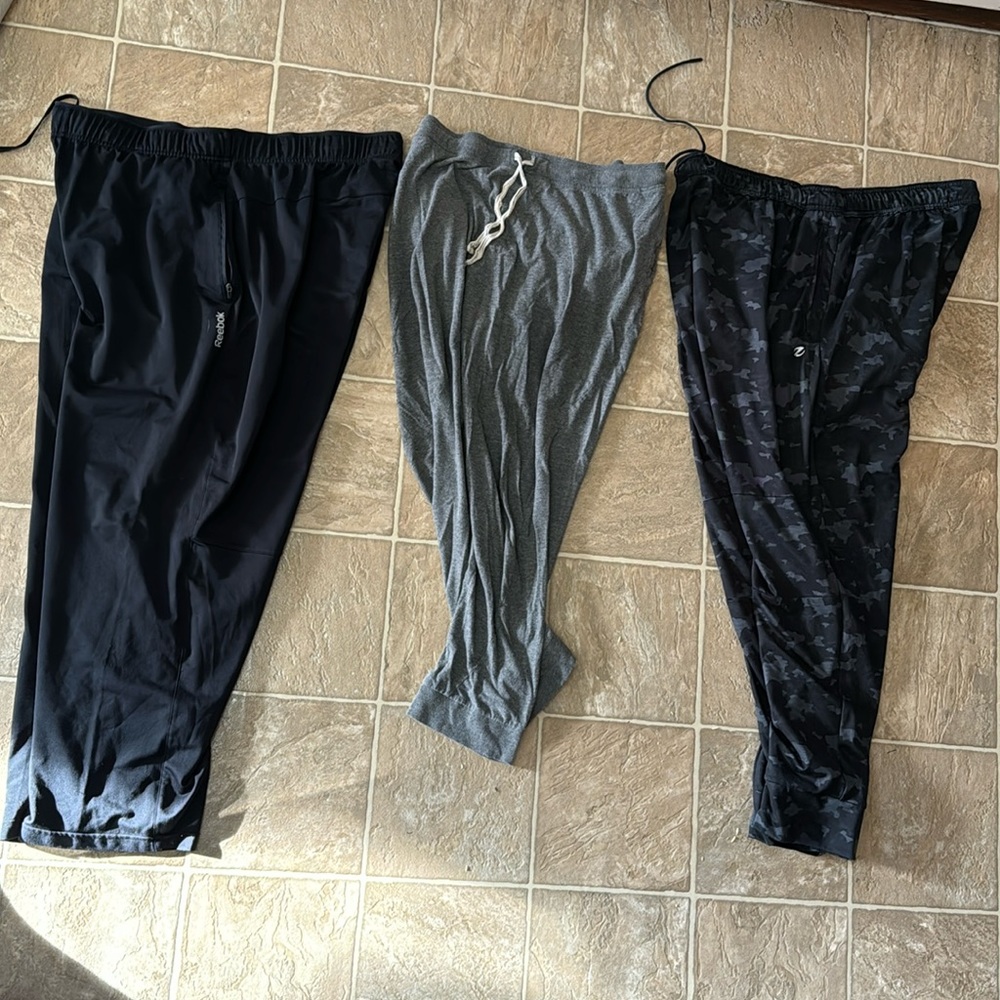 3 pair XL men’s joggers. Reebok (black),Energy zone (camo), and Bottoms out.
